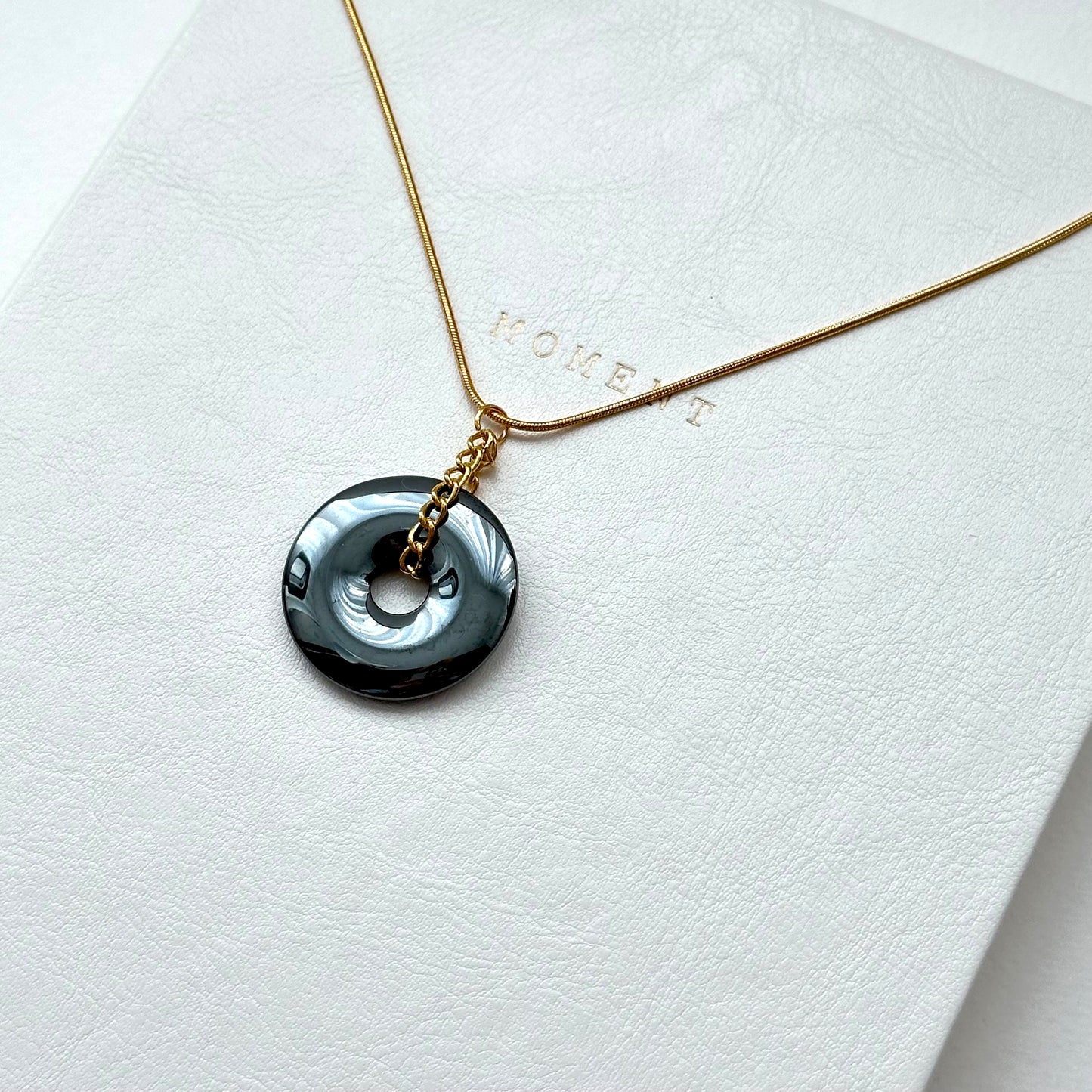 N68 [Protection and Implementation] Hematite Peace Buckle Gold-plated Necklace
