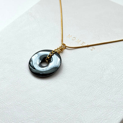 N68 [Protection and Implementation] Hematite Peace Buckle Gold-plated Necklace