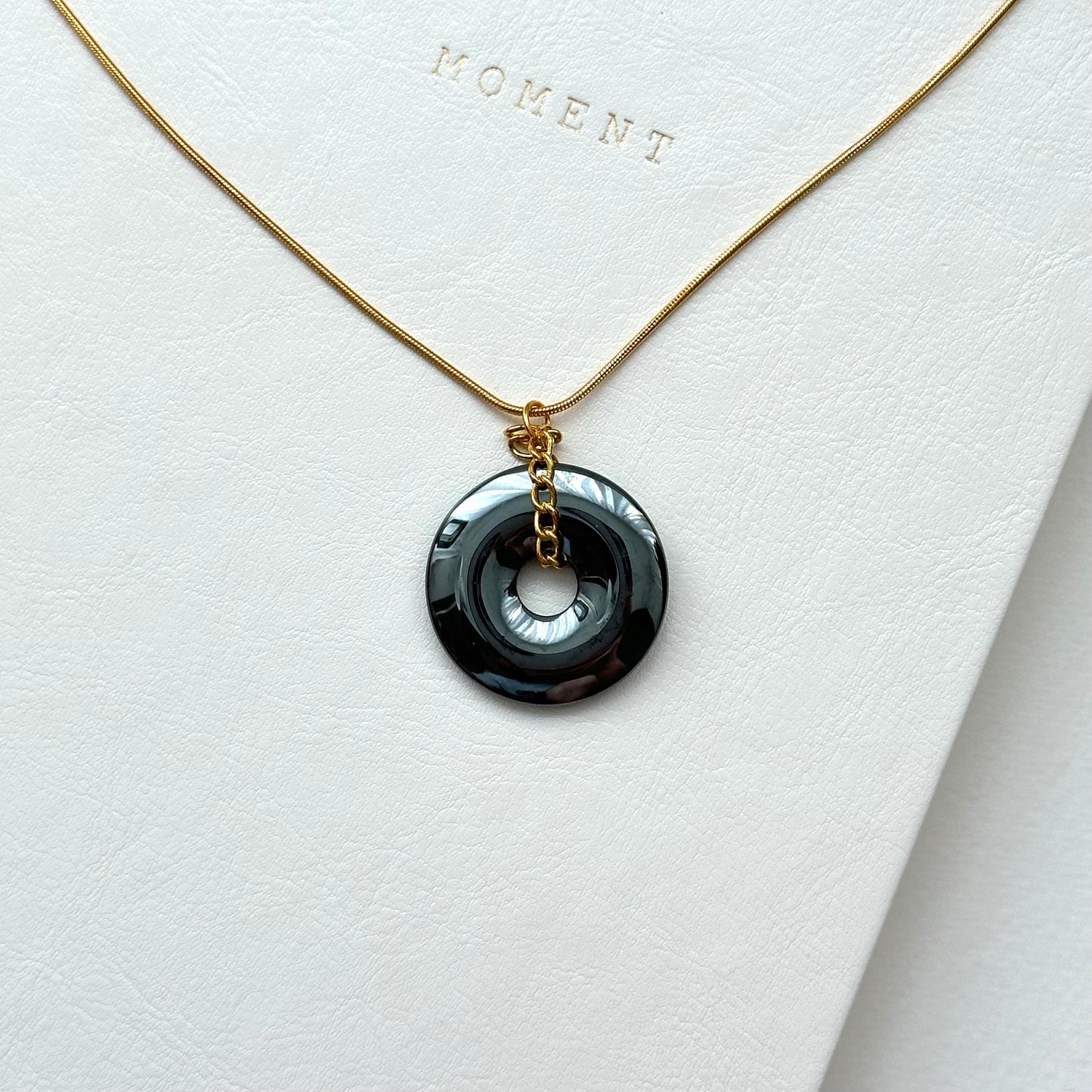 N68 [Protection and Implementation] Hematite Peace Buckle Gold-plated Necklace