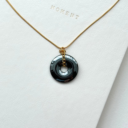 N68 [Protection and Implementation] Hematite Peace Buckle Gold-plated Necklace