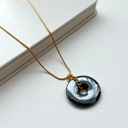 N68 [Protection and Implementation] Hematite Peace Buckle Gold-plated Necklace