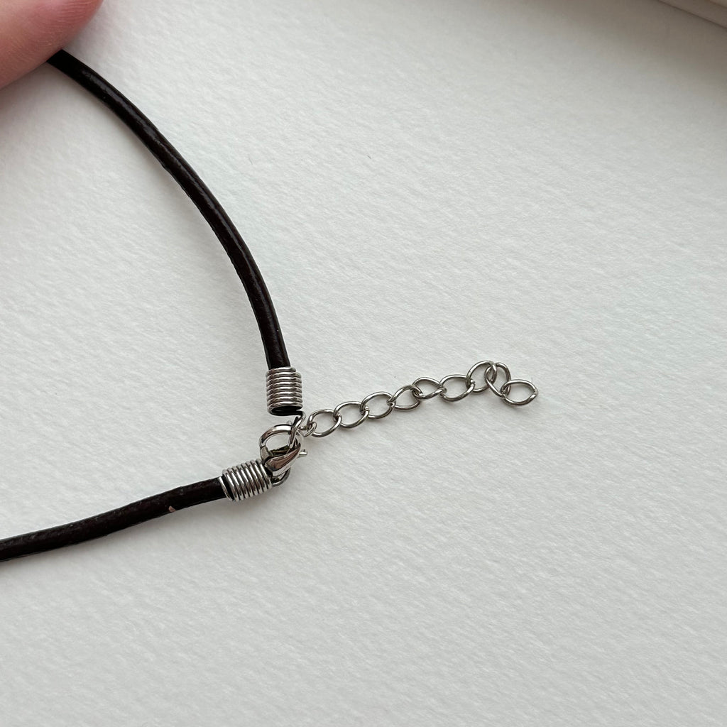 N90【Protection and Implementation】Hematite Peace Buckle Gold-plated Necklace