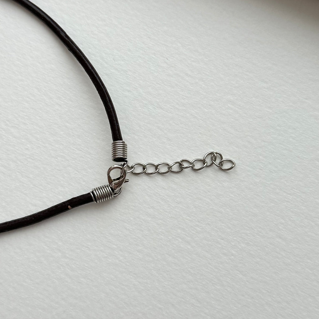 N90【Protection and Implementation】Hematite Peace Buckle Gold-plated Necklace